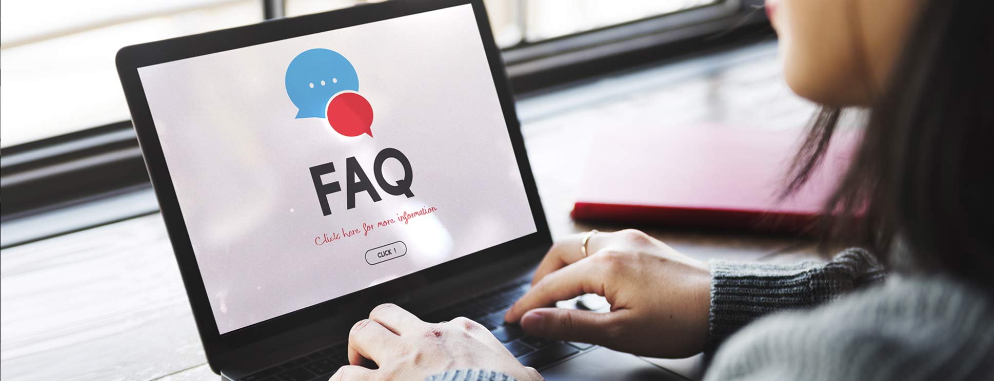 Woman-Typing-FAQs on-Laptop