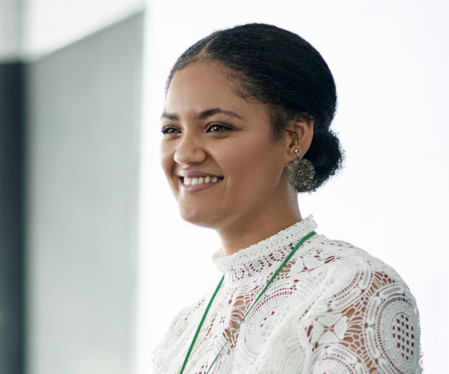 Young confident woman presenting speech at mic